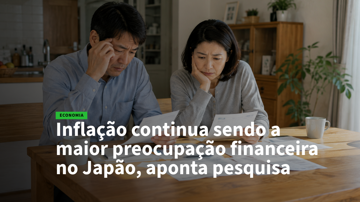 Casal sentado à mesa em casa, lendo papéis e parecendo preocupados com a inflação no Japão (notícia de economia).