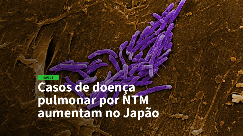 Purple bacteria on a dark brown background accompanies health news about rising NTM-related lung disease in Japan.